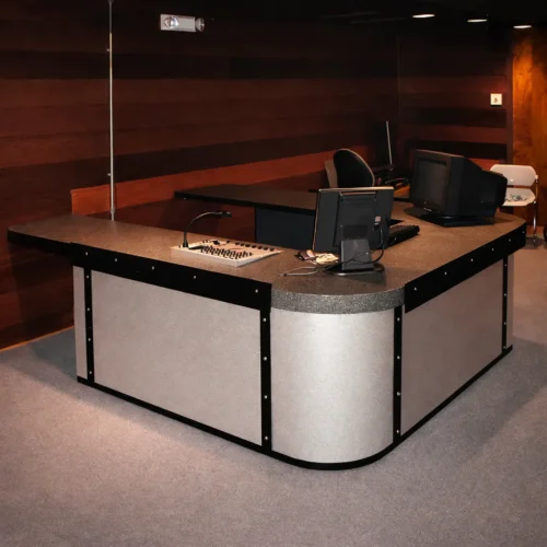 custom planetarium control desk with curved design and wood panel walls at St Charles Parish Library