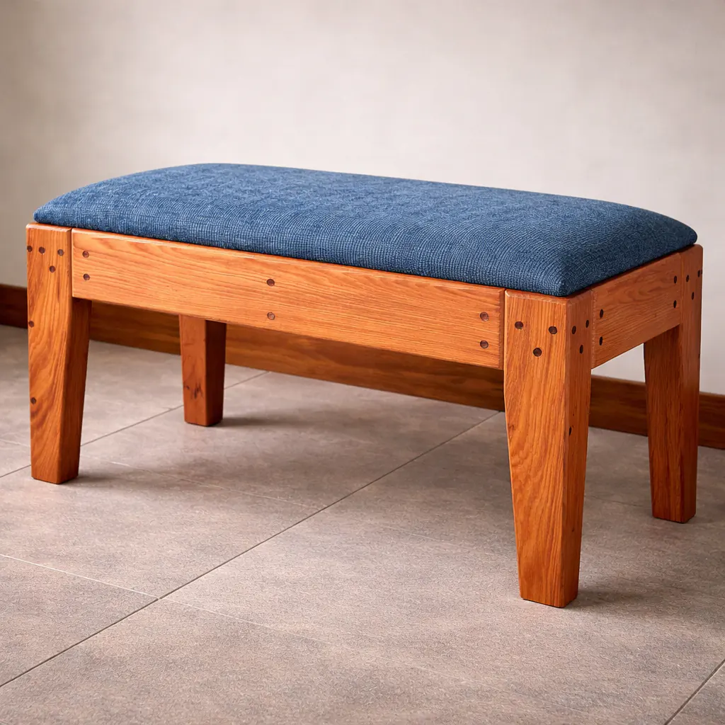 custom solid wood upholstered bench with blue cushion and handcrafted joinery