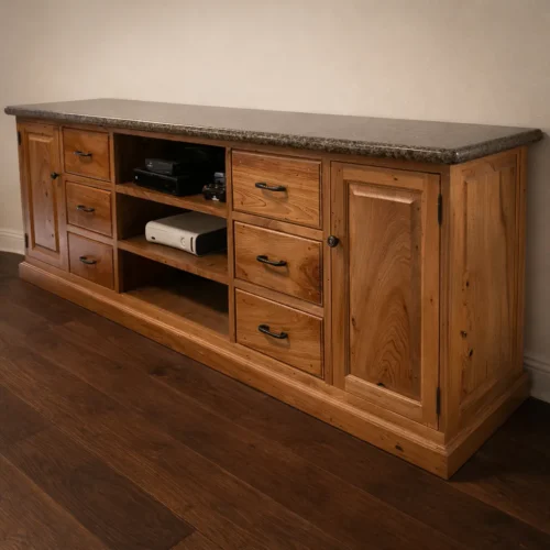 Custom heirloom media console built from reclaimed old-growth wood with granite top and precision drawer construction